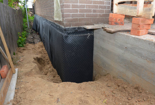 SJ Waterproofing Pros technician performing targeted Foundation Crack Repair assessment in Lemont, PA